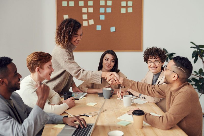 Client and retail partners agreeing on a customer acquisition campaign plan