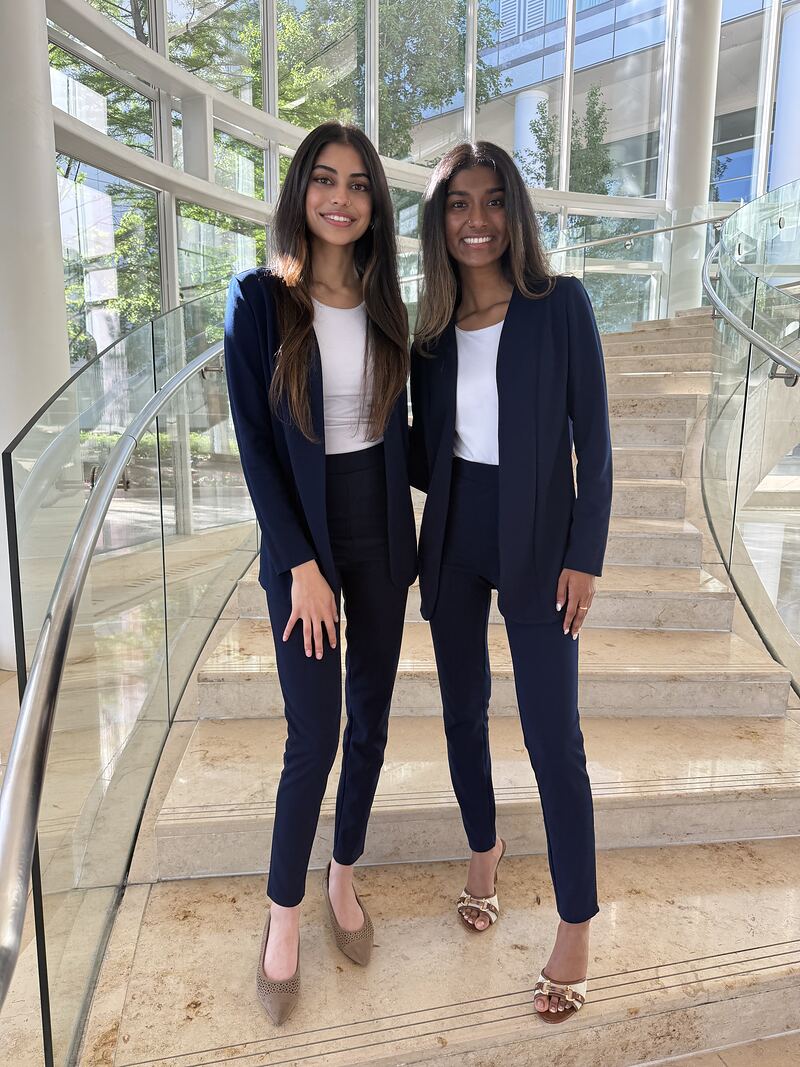 Two O.W.E Team customer experience representatives before a retail campaign shift